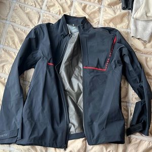 Under armour golf windbreaker, black and red. Never worn.